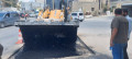 أعمال تعبيد طرق في ضاحية العزب